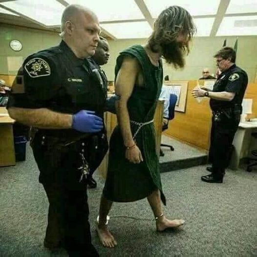 Police arrest Jesus carrying his cross on Good Friday for Not wearing face mask.